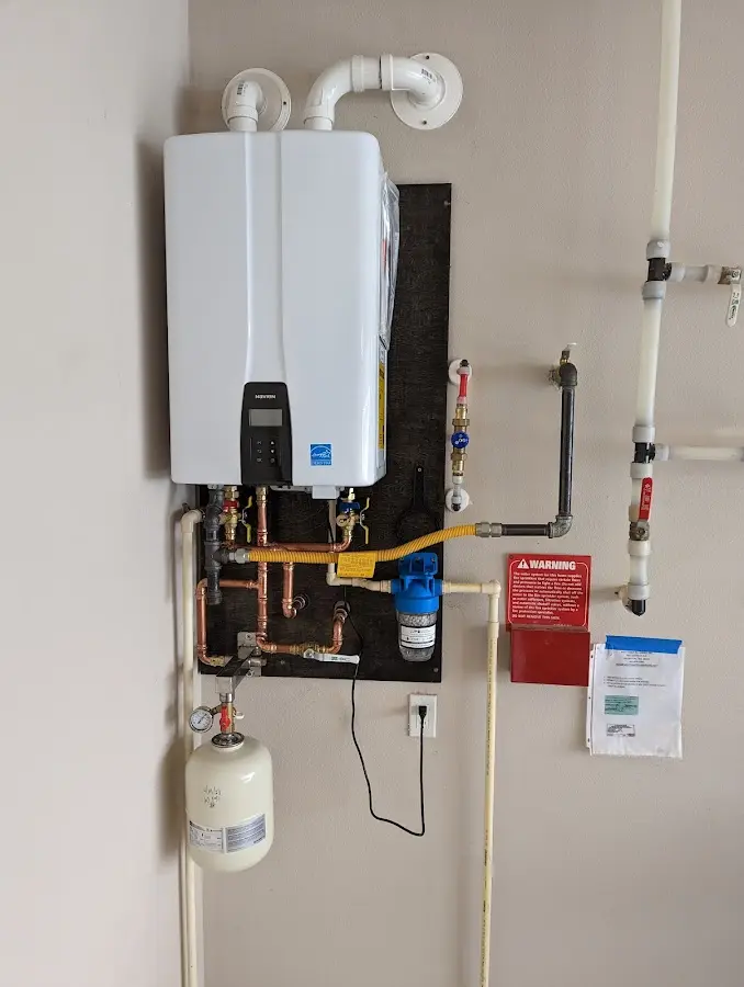 Professional plumber installing copper piping in a Sulphur Springs home